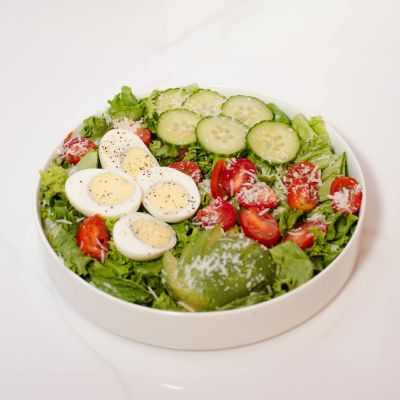 Fresh egg salad with mixed greens, cherry tomatoes, avocado, and homemade dressing – La Vie Belle Miami Beach