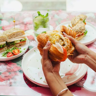 Assortment of Italian-style sandwiches including turkey, chicken, veggie and ham, served on artisan bread at La Vie Belle Miami