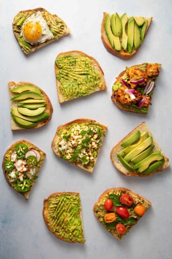 Healthy brunch options at La Vie Belle Miami Beach, featuring avocado toast and fresh fruit.